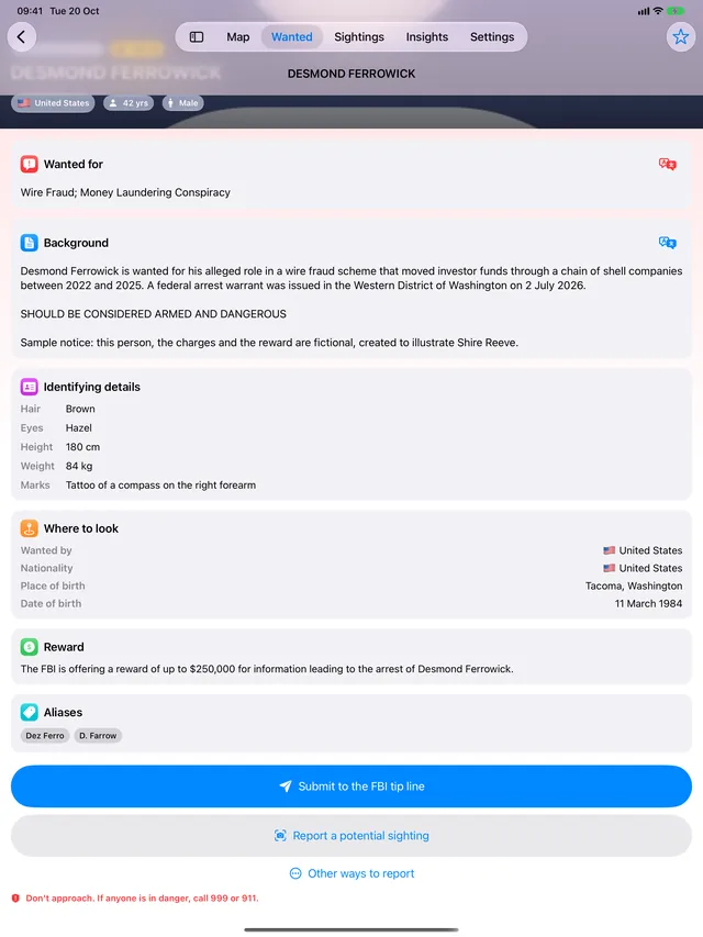 A sample wanted notice on iPad for a fictional person: what they are wanted for, a background note saying the notice is fictional, identifying details, reward, and the FBI tip line button.